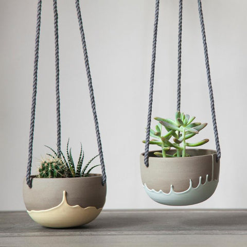 Ceramic hanging planters handmade in Canada. Grey stoneware with colored patterns.