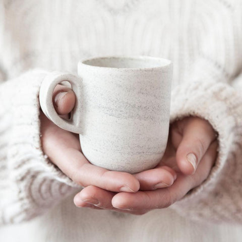 Modern ceramic mug handmade in Canada by Parceline. White with balck speckels.