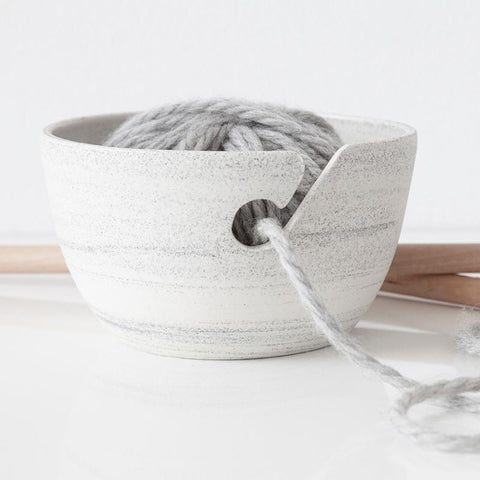 Ceramic yarn bowl handmade in Canada. Withe with black speckles.