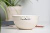 Personalized ceramic bowl, white with colored logo. Handcrafted in Quebec, Canada.