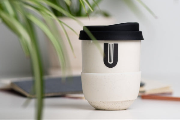 Promotional travel mug with logo. Ceramic mug handmade in Canada.